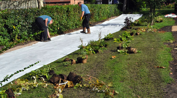 a covering to prevent weeds is laid